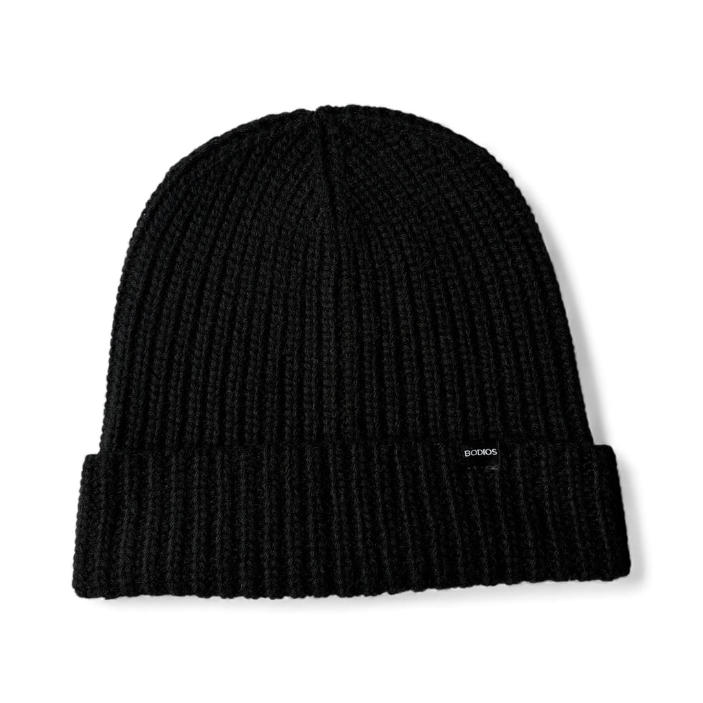 Black knit beanie with a brand logo on a white background